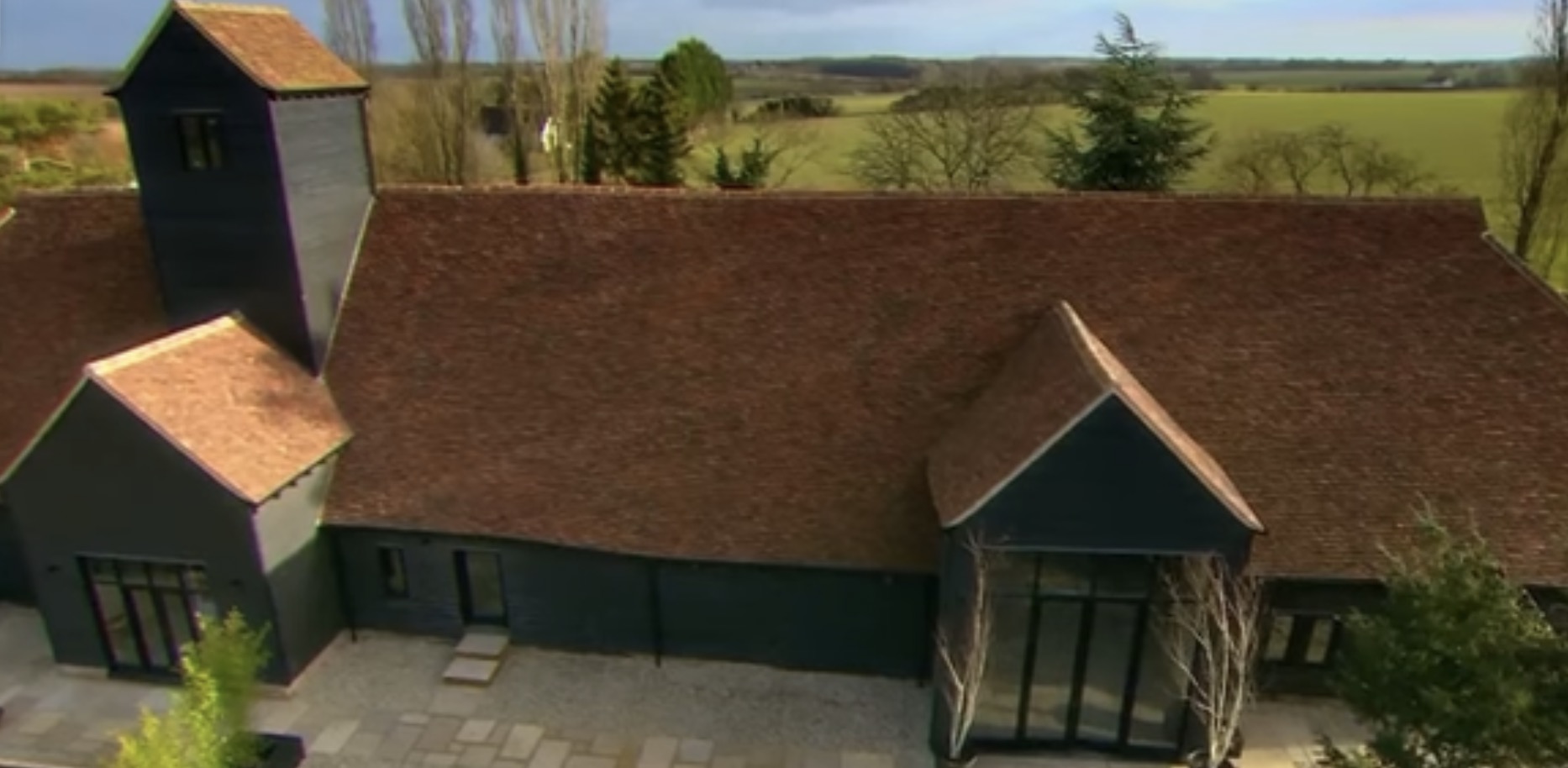 Aerial view of The Barn set in the surrounding countryside