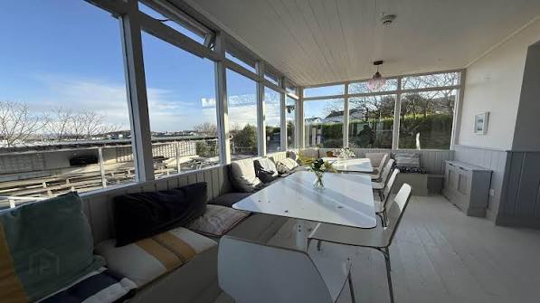 Sunroom dining space at Carnaween House